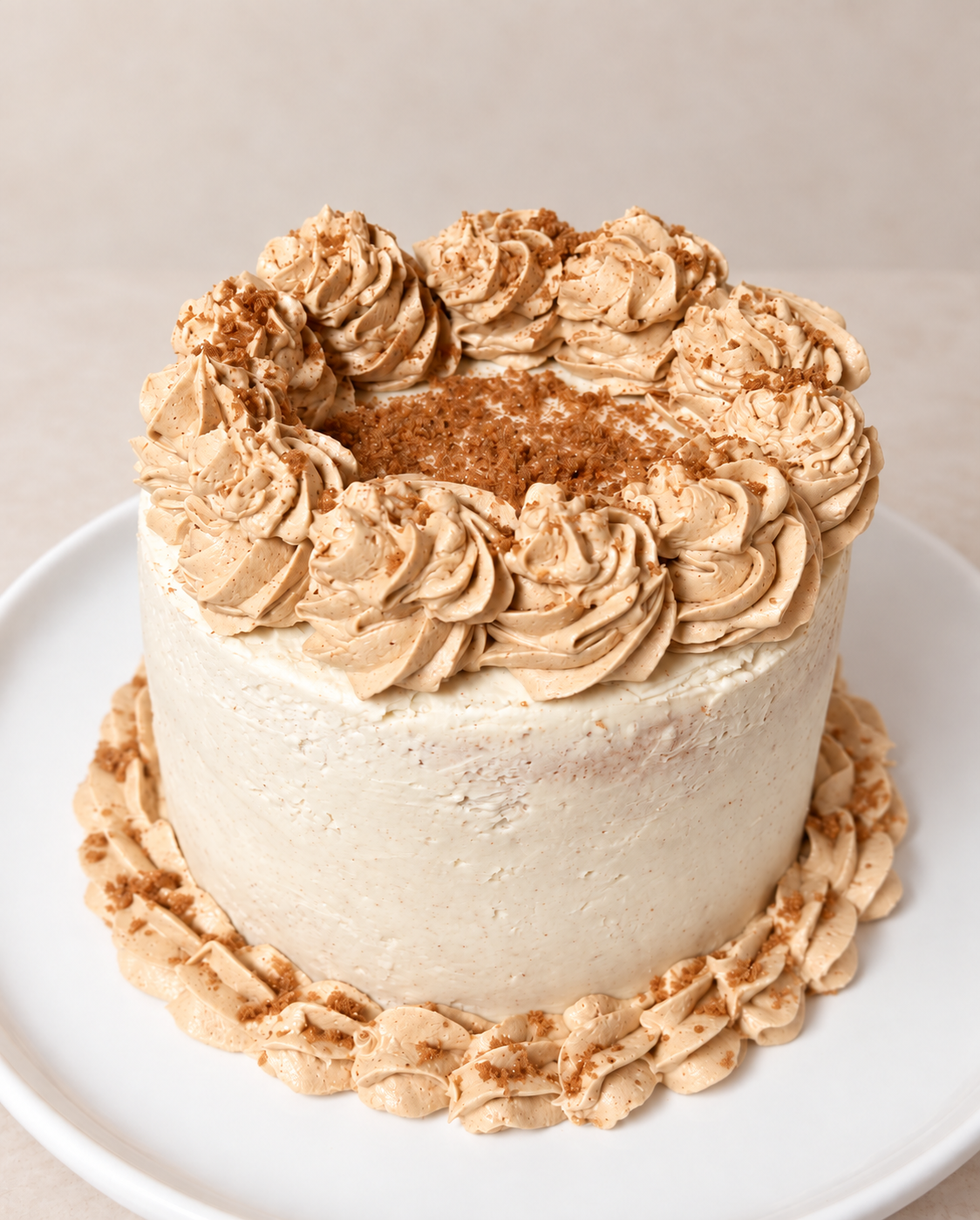 Brown sugar cinnamon cake with vanilla cinnamon buttercream rosettes and cinnamon brown sugar streusel
